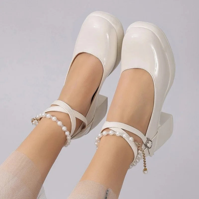 Off-white Mary Jane pumps with pearl ankle straps and chunky heel
