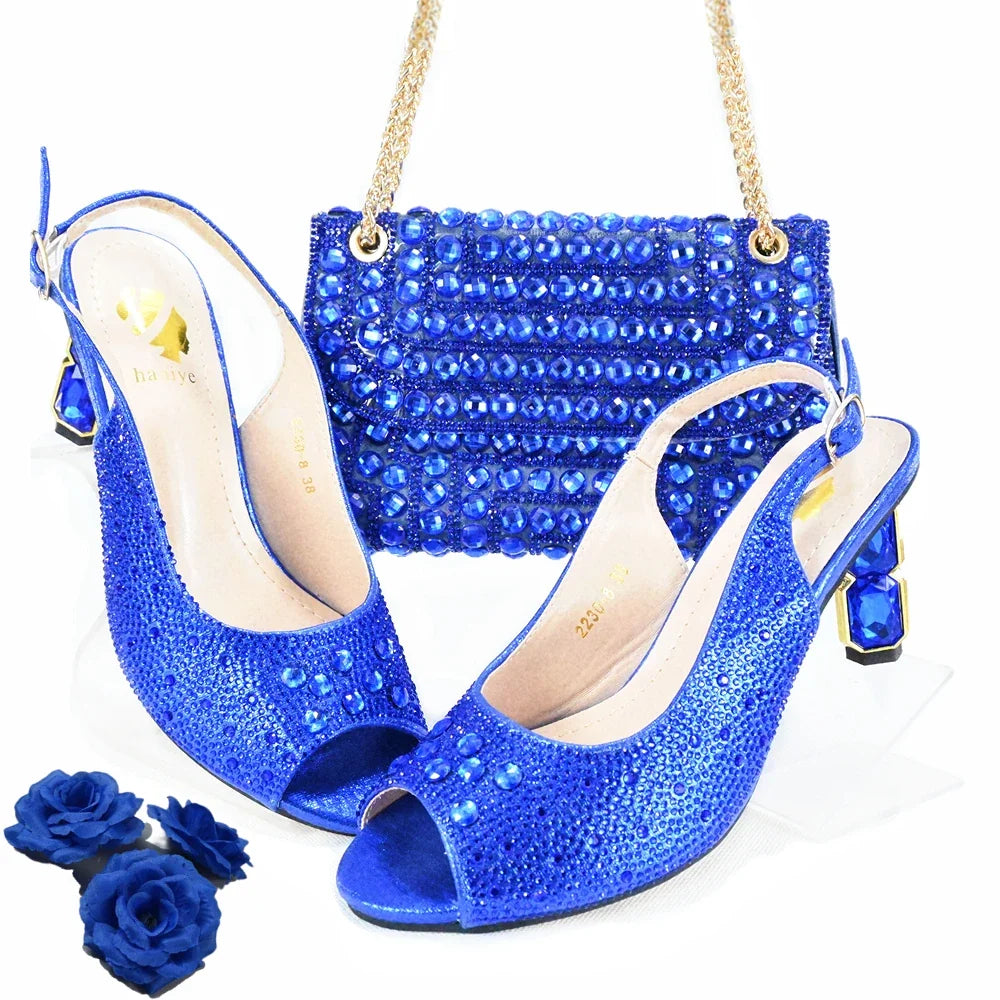 Royal blue rhinestone peep-toe heels with matching beaded handbag and chain strap