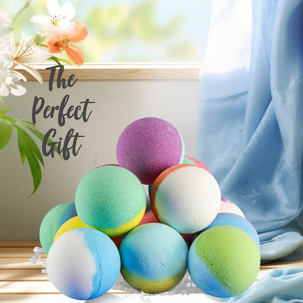 Pile of colorful kids bath bombs arranged next to a blue fabric backdrop