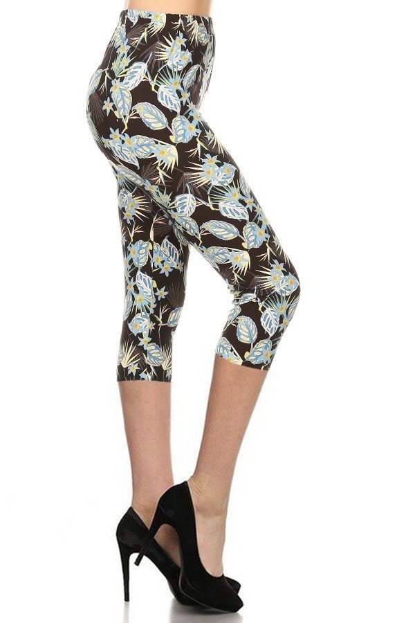 Light green leaves printed capri leggings, dark background, slim fit