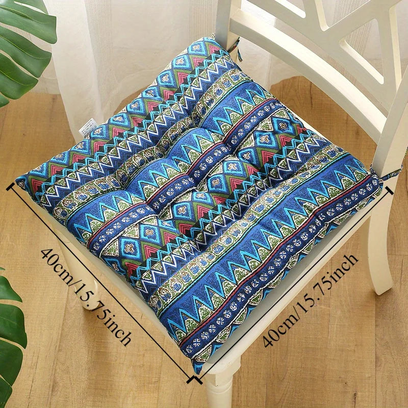 Blue patterned square seat cushion with carrying strap and size markings