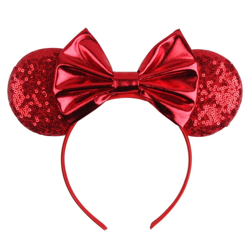 Red sequin Mickey-style ears headband with glossy red bow and curved band.