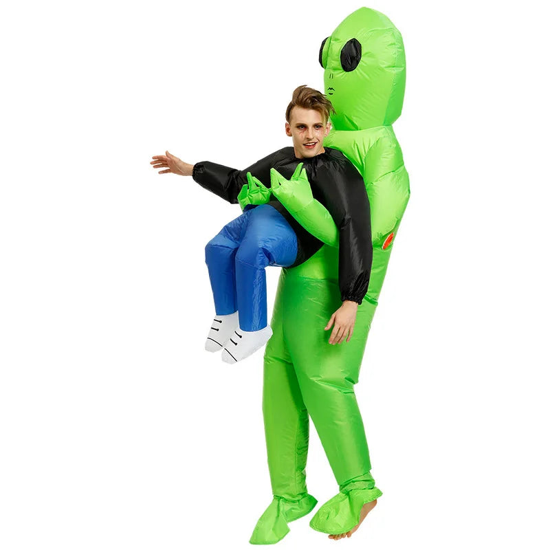 Inflatable green alien suit with black arms and torso, blue pants, spiked green shoulder detail.