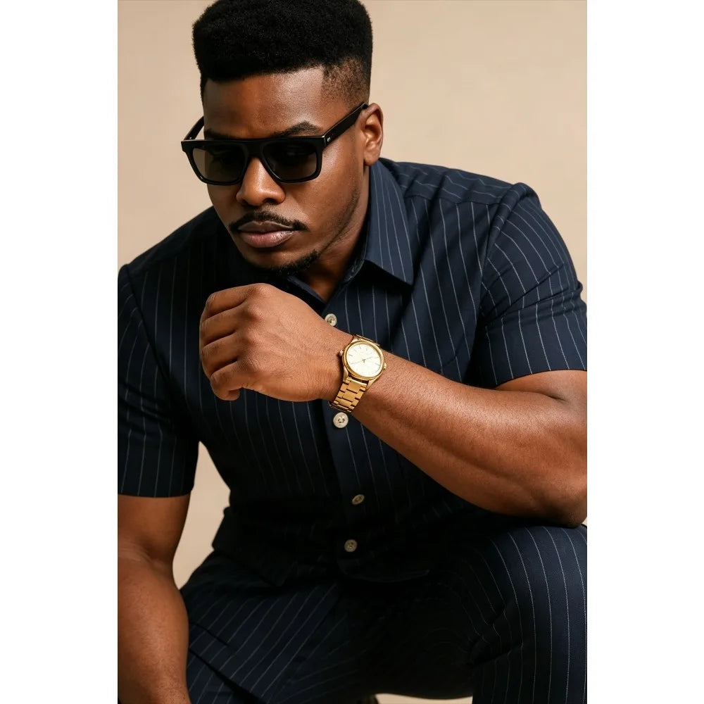 Navy striped short-sleeve shirt with button front and chest pocket, close-up fit detail