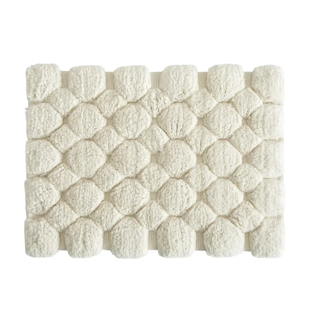 Ivory cotton bath rug mat with raised dome texture, rectangular with plush pile