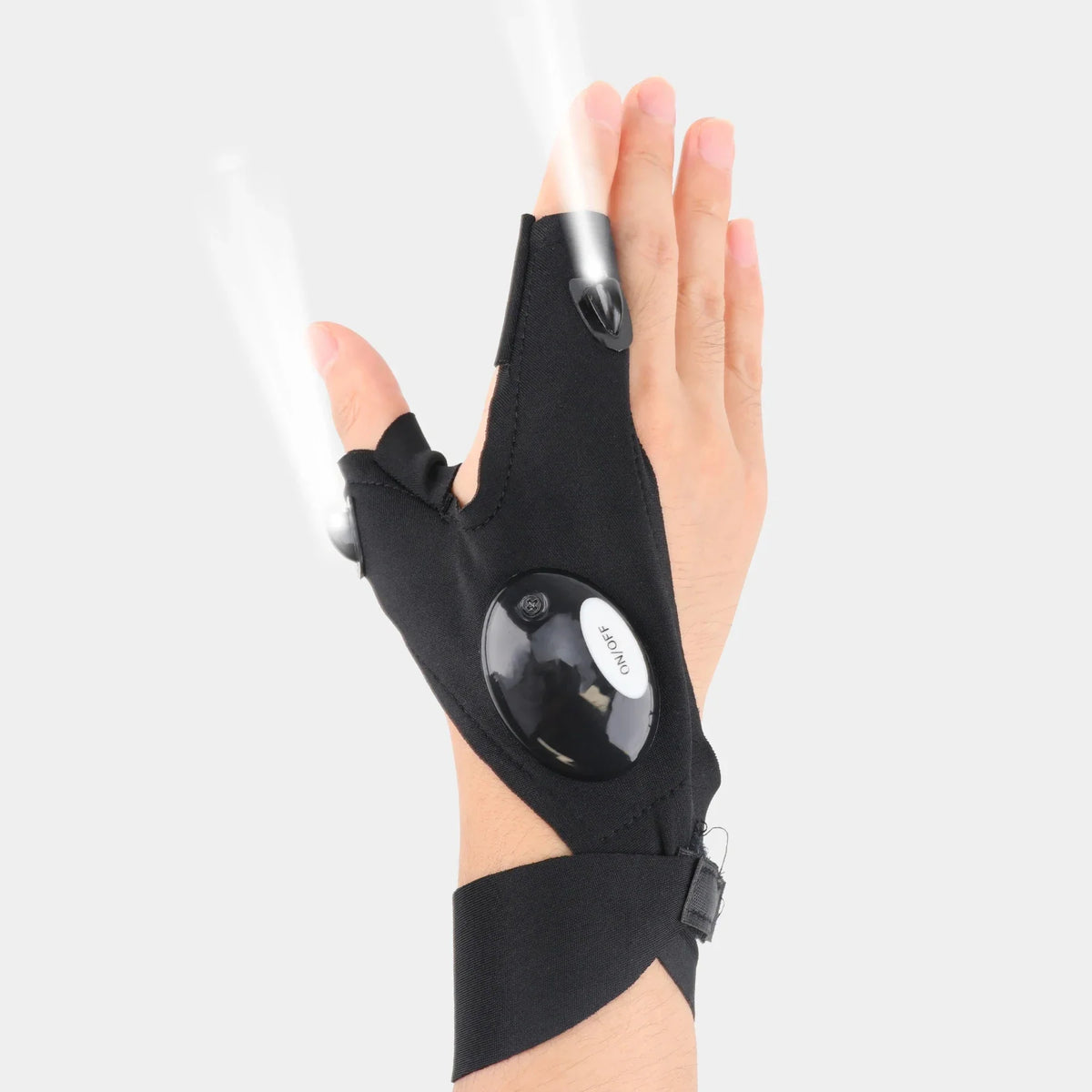 Black fingerless LED flashlight glove on hand with bright beam from thumb module