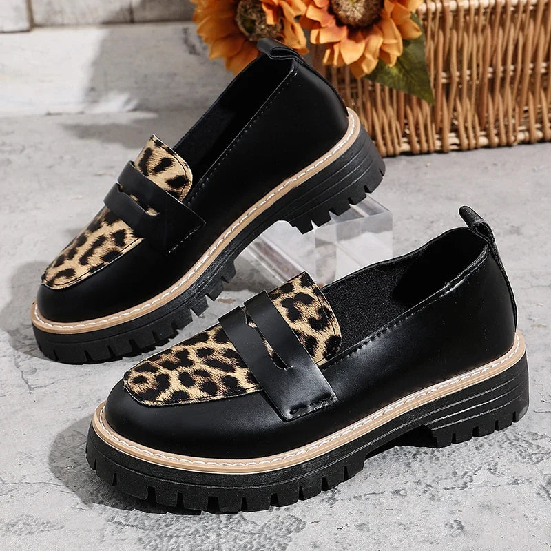 Women’s platform loafers, black with leopard-print front panels and thick tread sole