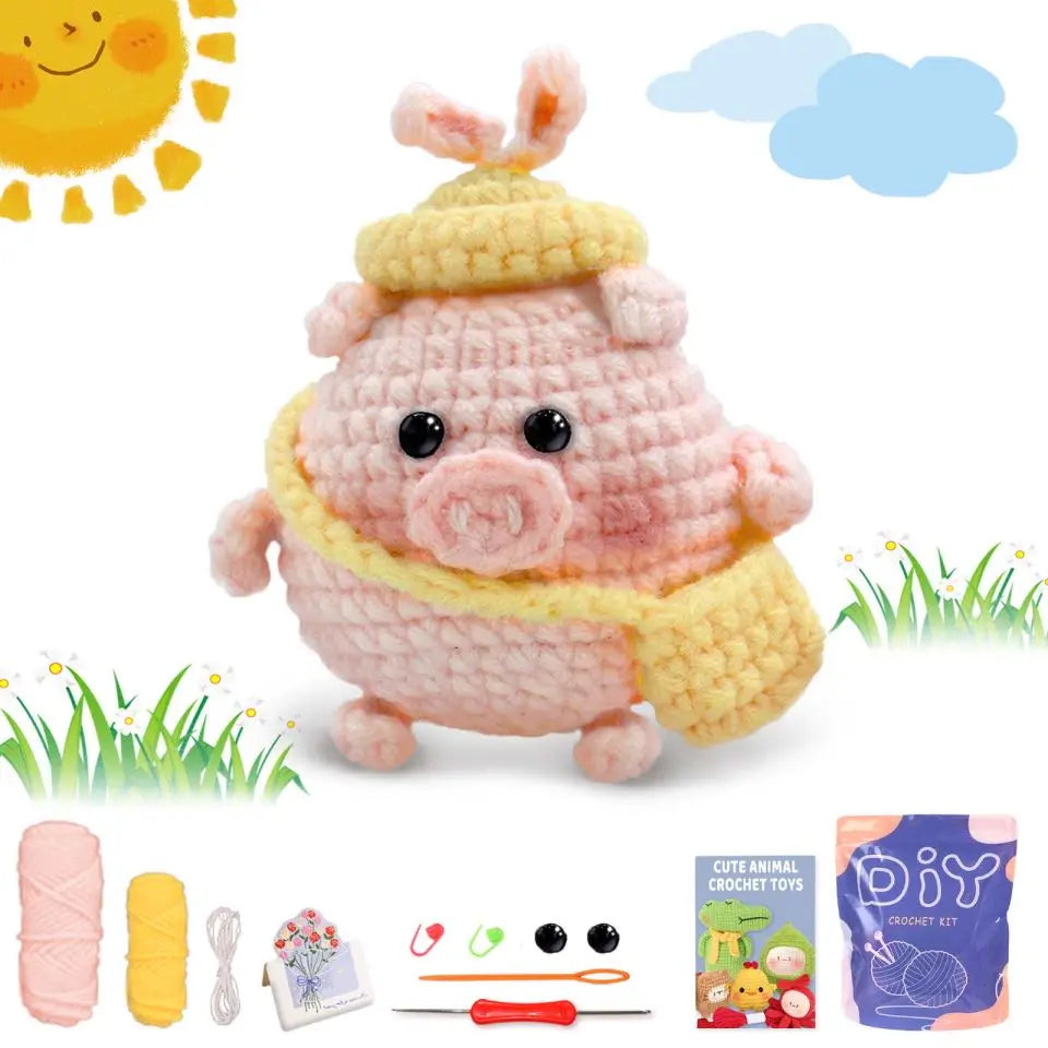 Crochet animal toy kit with pink-and-yellow pig plush, yarn balls, and hook