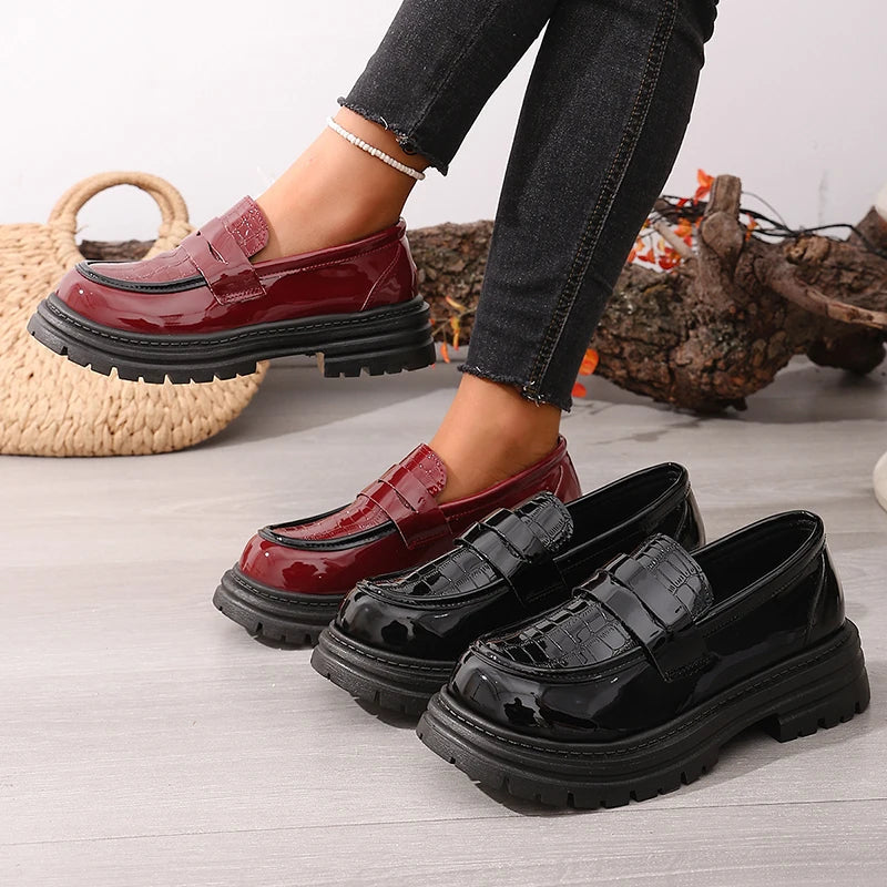 Red and black patent leather chunky platform loafers with round toe slip-on straps