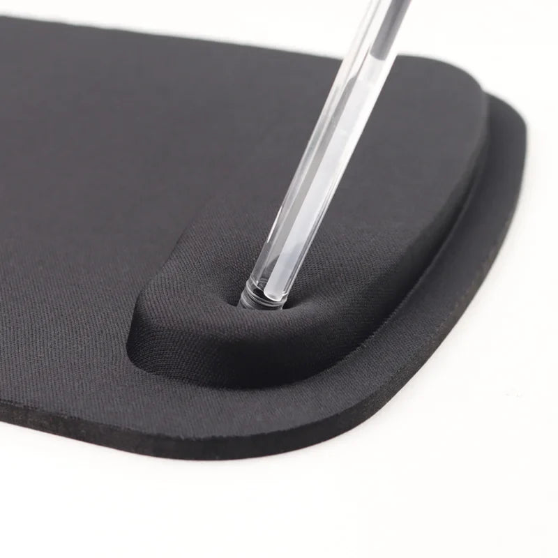 Close-up of black padded wrist rest on ergonomic mouse pad