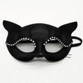 Black cat masquerade mask with rhinestone trim, central round bead, ribbon tie, eye cutouts