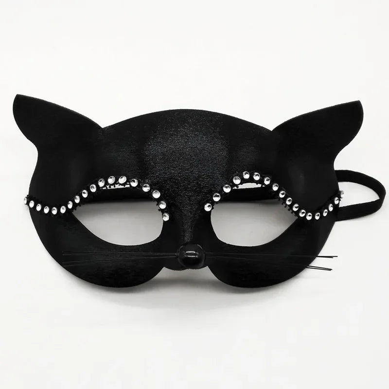 Black cat masquerade mask with rhinestone trim, central round bead, ribbon tie, eye cutouts