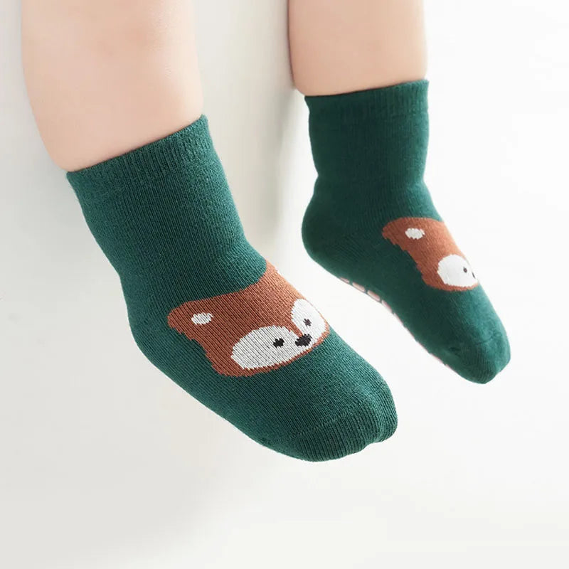 Green non-slip socks with fox face graphic and textured grippy sole
