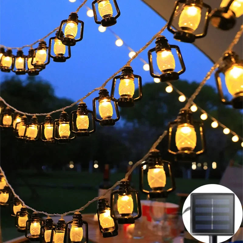 Solar bottle lantern string lights with warm glowing glass lamps on dark wire