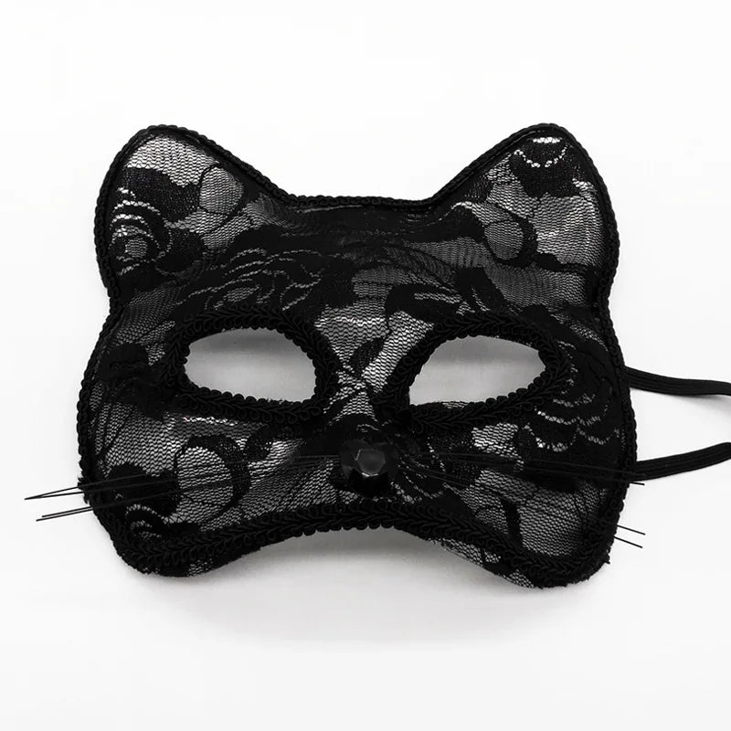 Black lace cat masquerade mask with filigree pattern, central bead, ribbon ties, eye cutouts