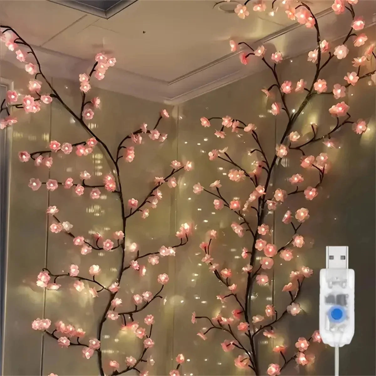 Cherry blossom rattan branch LED string lights with pink flower bulbs, warm white glow