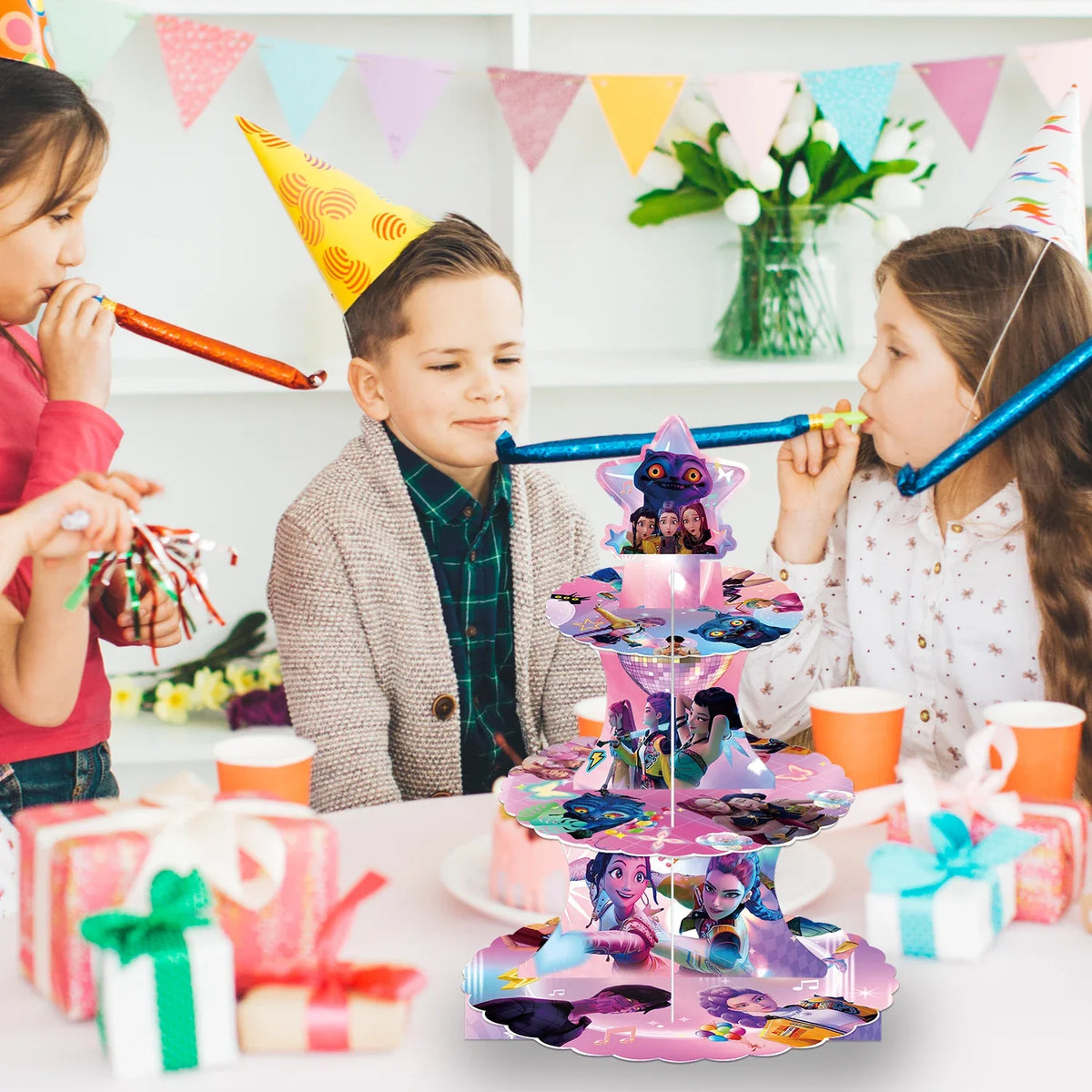 Three-tier star-shaped dessert stand on table with colorful character graphic