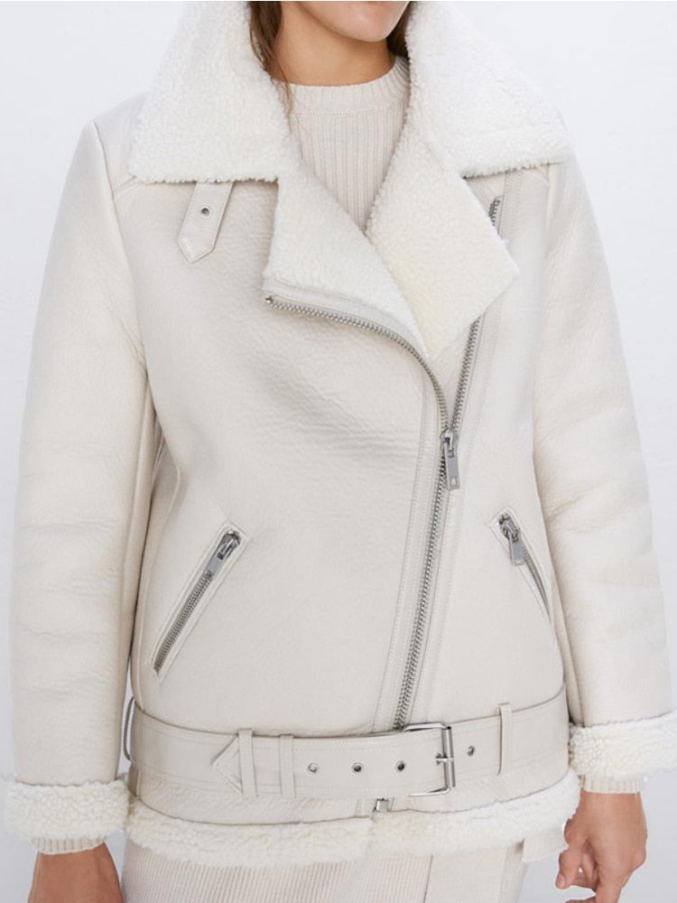 Cream faux lamb leather moto jacket with shearling trim, zip pockets, and belt strap