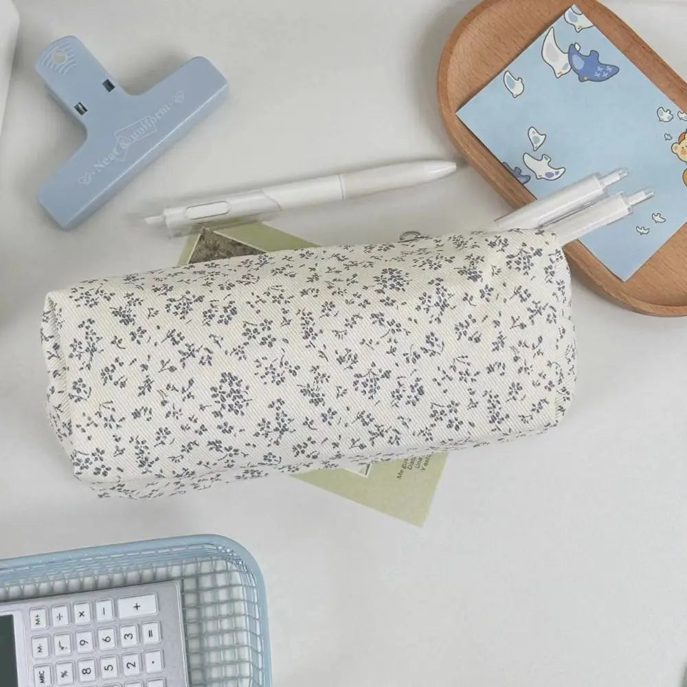 Floral canvas pencil case with cream base and small navy flower pattern