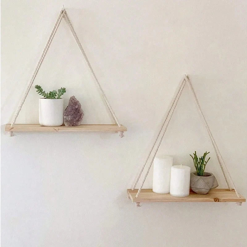 Triangular hanging wooden shelf with hemp rope, small plant and candle accessories