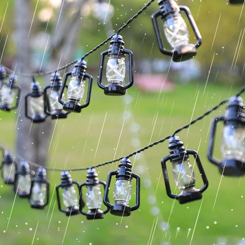 Weatherproof solar lantern string lights with glass bottle lamps in rainy conditions