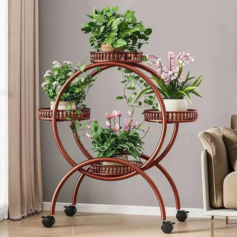 Brown metal multi-tier circular plant stand with ring shelves and rolling casters