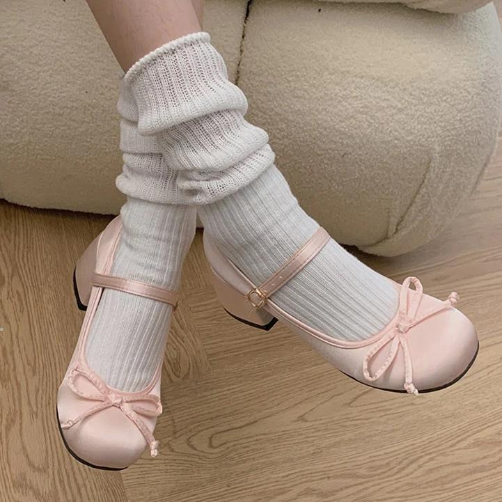 Pink Mary Jane ballet flats with ankle strap and bow detail
