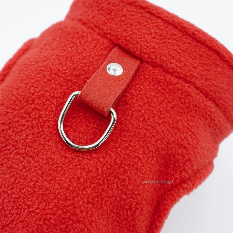 Red fleece pet jacket with D-ring on a tan webbing strap