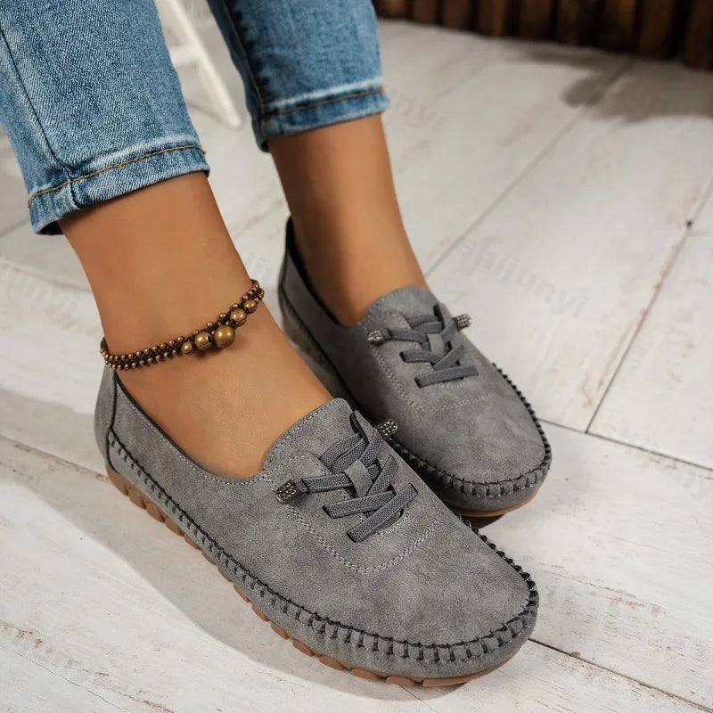 Women's lace-up loafers in gray suede with round toe and stitched moccasin sole