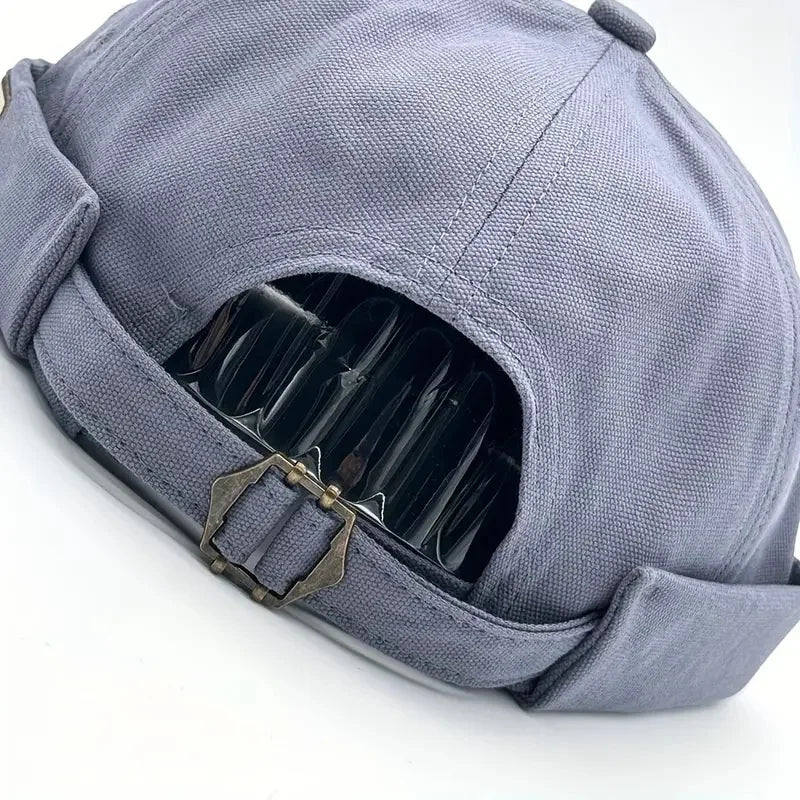 Light blue dome cap with open side showing inner lining and adjustable strap