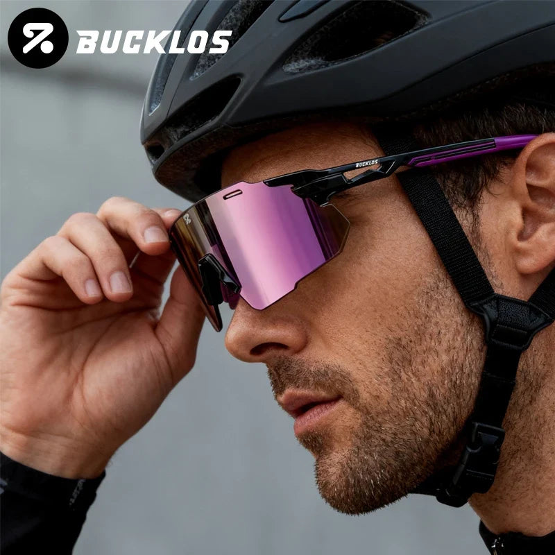 Cycling sports goggles with black frame, purple mirrored lens, and adjustable head strap
