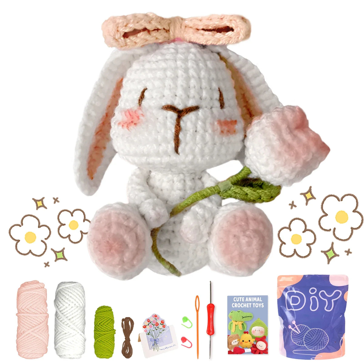 Crochet animal toy kit with white bunny plush, pink bow, yarn balls, and hook