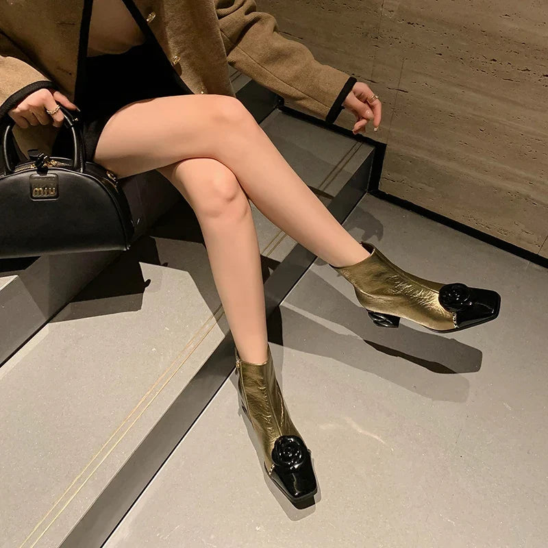 Women’s ankle boots with square toe, metallic gold finish, and chunky block heel