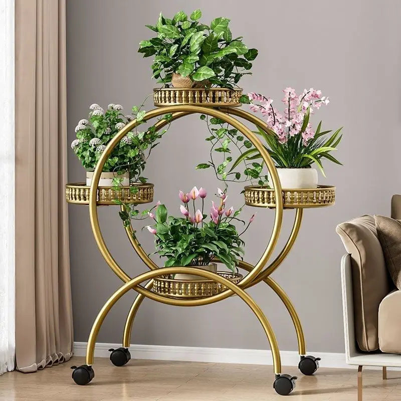 Gold metal multi-tier circular plant stand with ring shelves and rolling casters