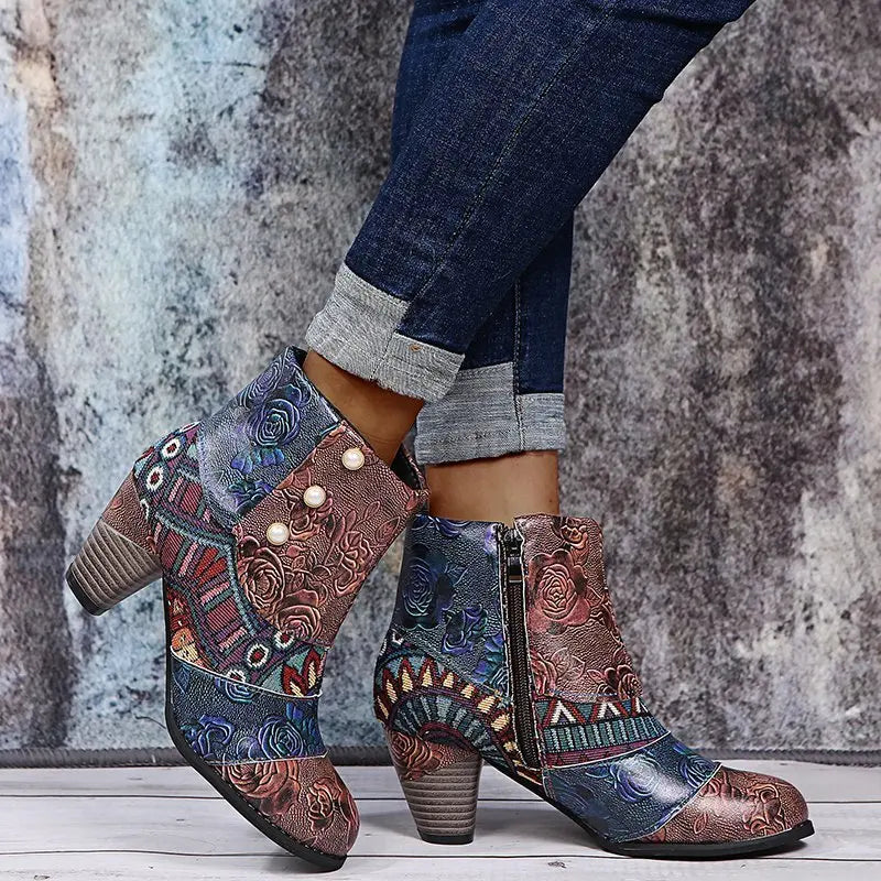 Women’s ankle boots with multicolor paisley print, side zipper, and textured mid heel.