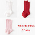 Kids knee-high striped socks in white, red, and pink, shown as three pairs.