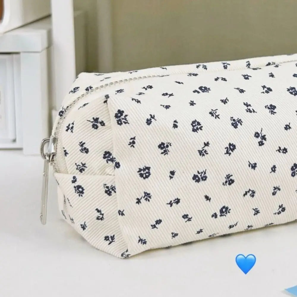 Floral canvas pencil case in cream with navy allover flower print
