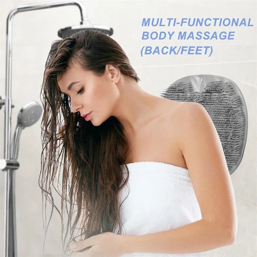 Round back and feet scrubber pad with raised bristles on a shower wall
