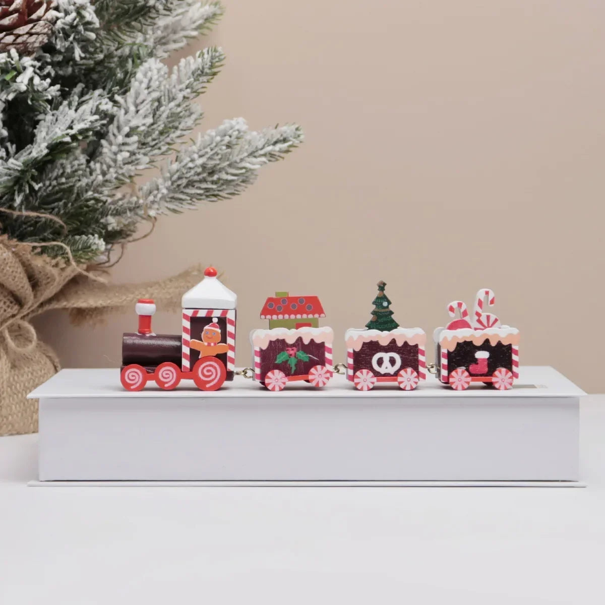 Mini painted wooden Christmas train set with red chimney engine and striped carriages