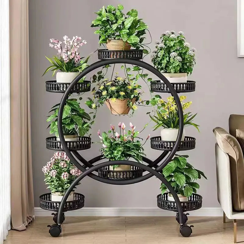 Black metal multi-tier circular plant stand with ring shelves and rolling casters