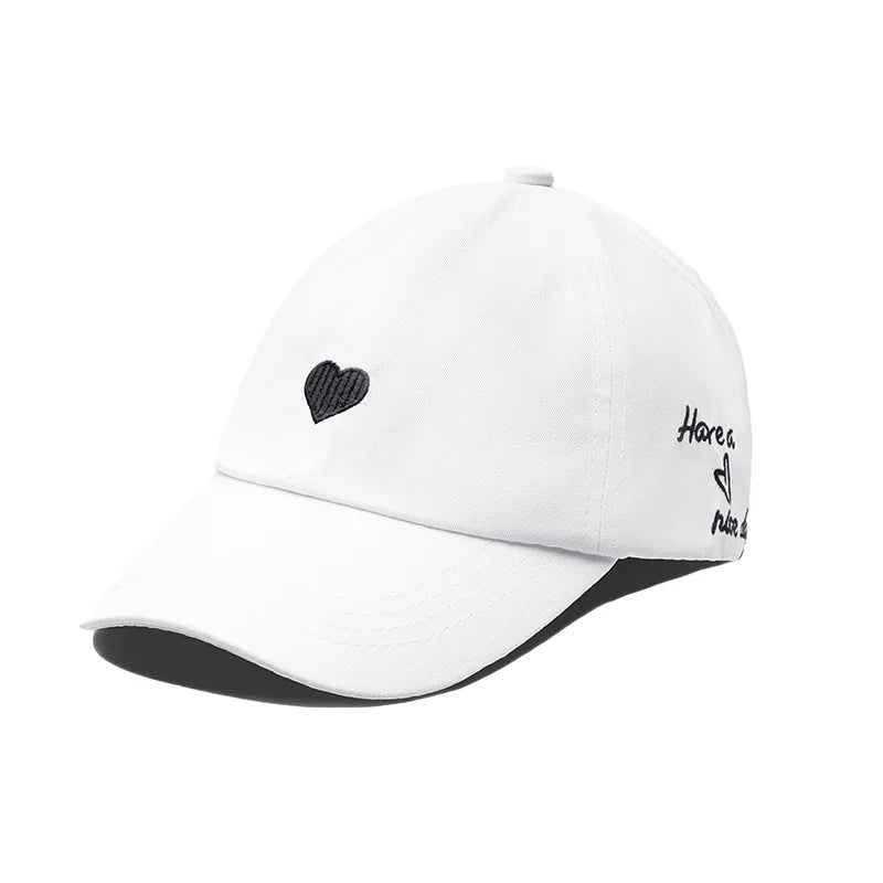 Kids cotton baseball cap, white with black heart embroidery and curved brim