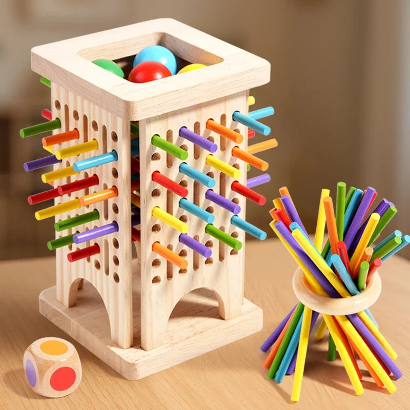 Wooden stick battle tower with colorful sticks and loose stick bundle plus dice