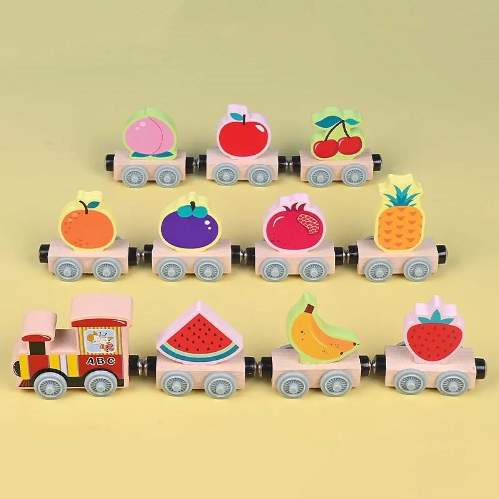 Wooden magnetic train set with fruit block toppers, including pineapple, banana, watermelon, and apple
