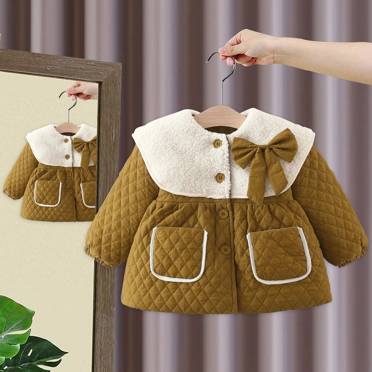 Olive quilted baby jacket with white fleece collar, large bow, and front pockets
