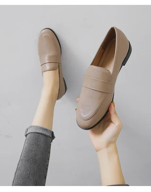 Women’s apricot leather slip-on loafers, round toe, low flat sole.