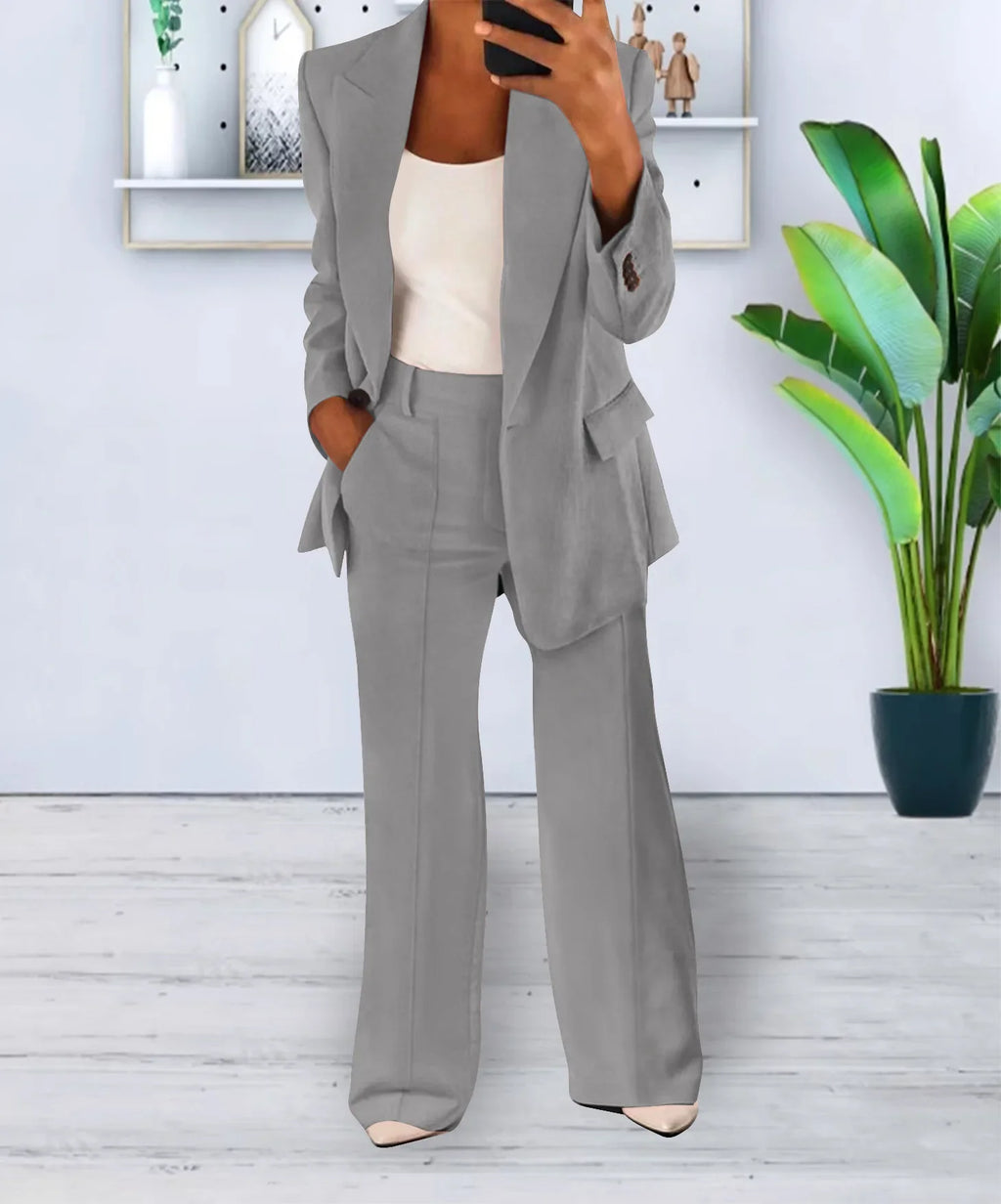 Women’s two-piece suit set with long-sleeve blazer and high-waisted trousers, light gray.
