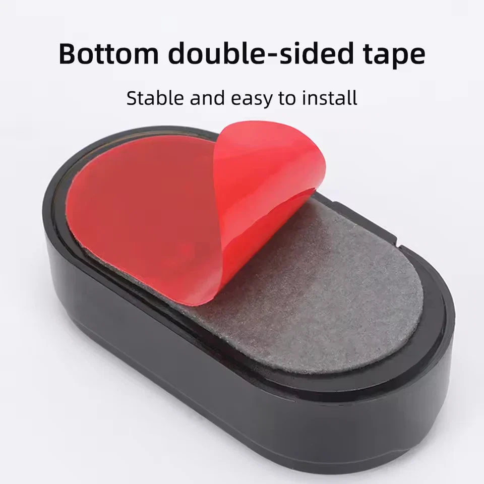Black solar dummy alarm light with double-sided tape pad on the underside