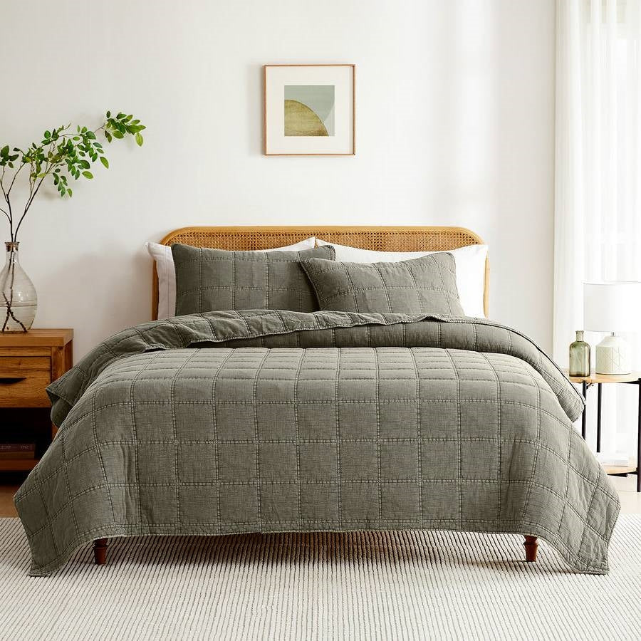 Cotton quilt and shams set in faded sage green, quilted grid stitched texture
