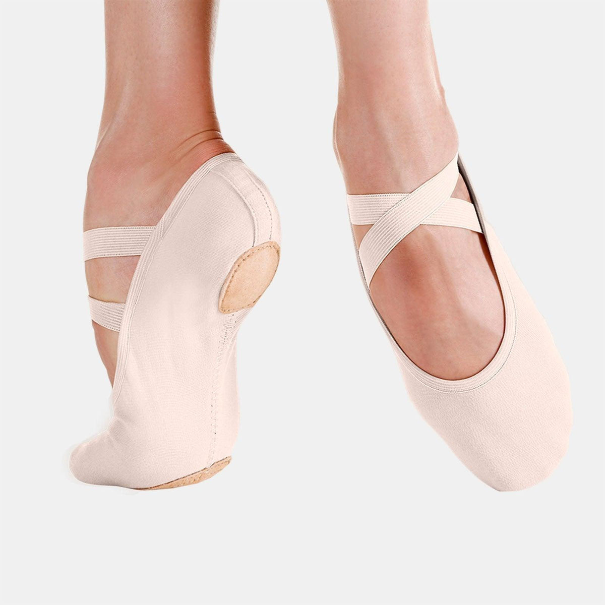 Adult pale pink canvas ballet shoes with elastic strap across instep