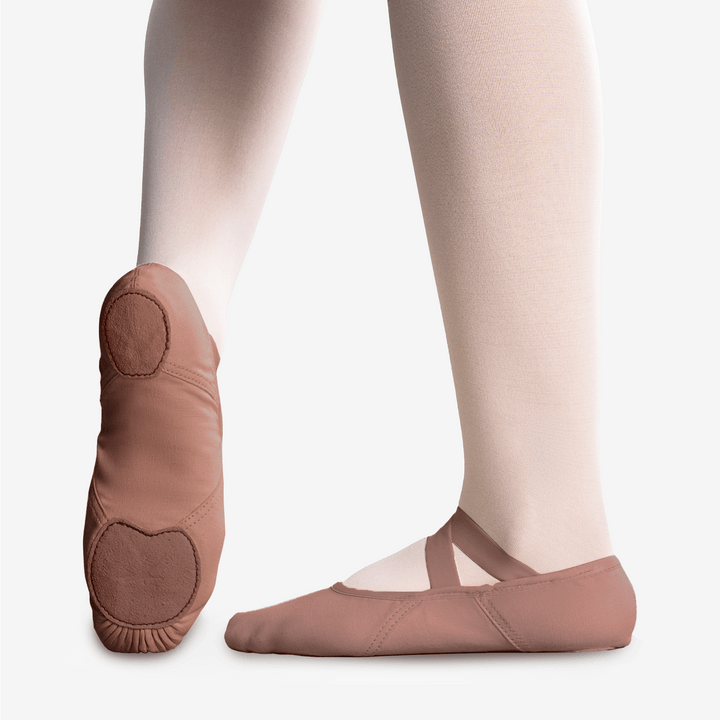 Rose pink canvas ballet shoe with elastic strap and split sole, rounded toe pads